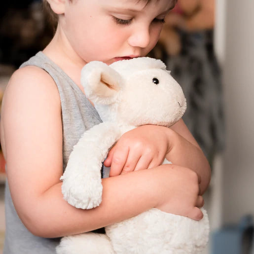 Child with stuffed animal deals